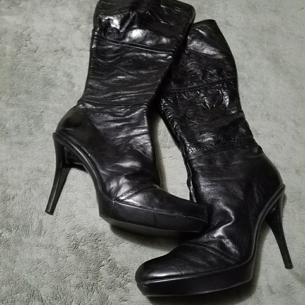 Pair of doll house brand high heel boots